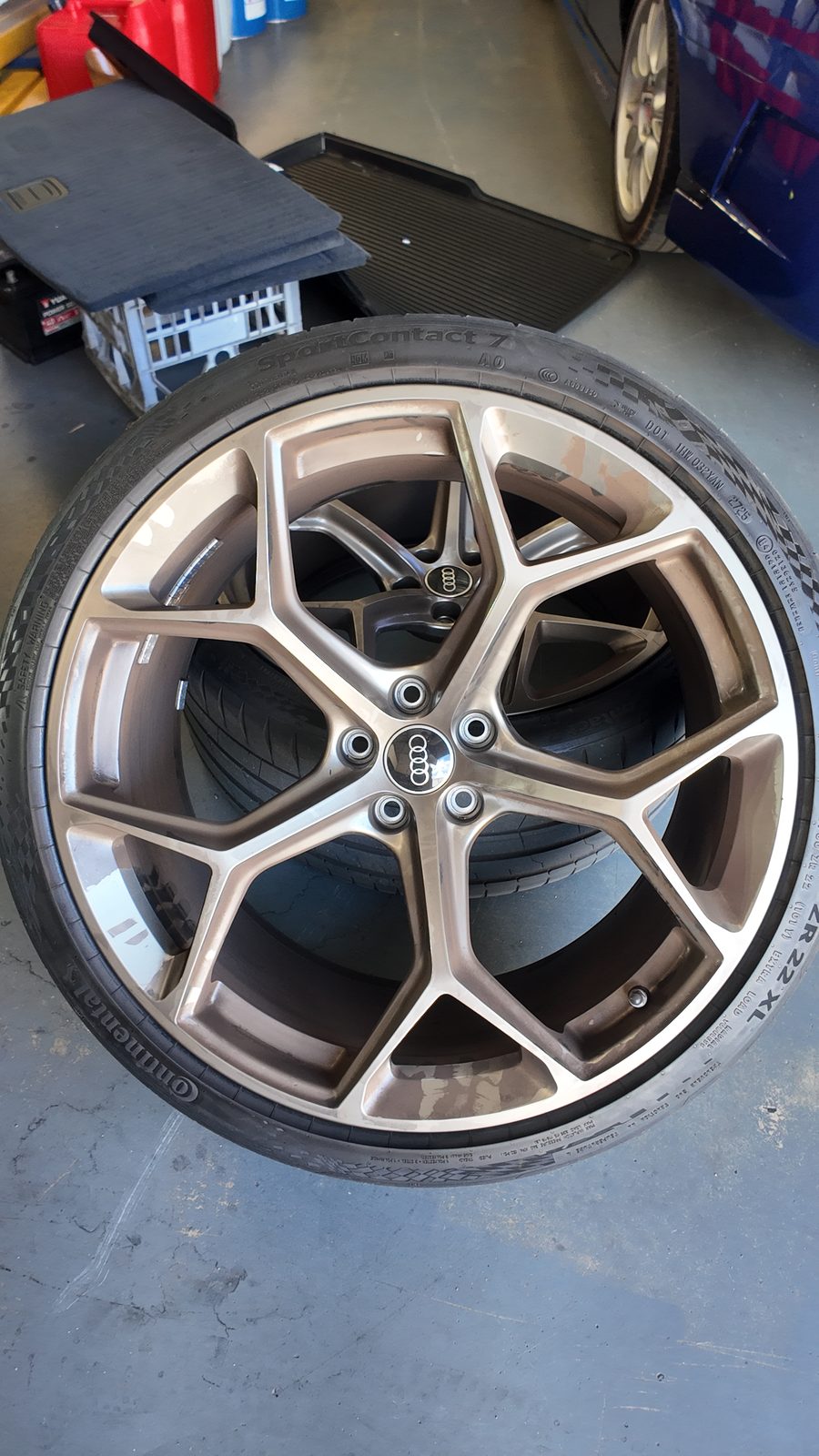 One of the RS6's bronze wheels, off the car in the workshop